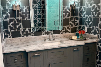 Minimalist master marble floor and wallpaper bathroom photo in Raleigh with a built-in vanity