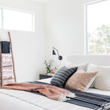 Rustic Ladder with Upholstered Bed with Pink and Black Bedding