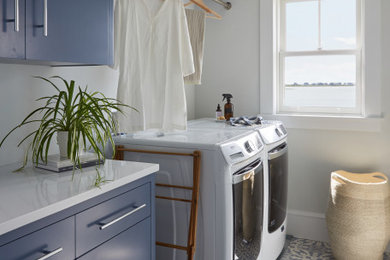 Example of a beach style laundry room design in Portland Maine