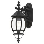 Livex Lighting - Textured Black Traditional, Colonial, French Historical, Outdoor Wall Lantern - The classically transitional outdoor Frontenac collection boasts a cast aluminum structure with dazzling ornamental design.  The downward hanging single-light small six-sided wall lantern comes in a textured black finish with clear beveled glass and extravagantly decorative scrolls. The ornate quality of this light will add radiance to your house exterior day or night.
