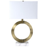 Renwil - Skipton Table Lamp, Antique Bronze - A seamless blend of warmth and edge, this modern design offers equal parts artistry and function. A myriad of antique bronze finished iron, white marble, and cream fabric, its unique structure makes it an ideal fit for the contemporary entryway table.1