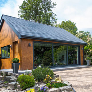 This is an example of a contemporary home office and library in Dorset.