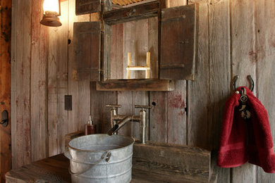 Powder room - rustic powder room idea in Denver with a vessel sink, wood countertops and brown countertops