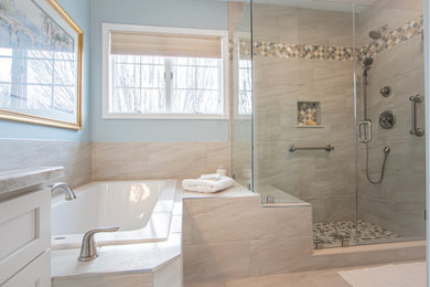 Inspiration for a transitional master porcelain tile porcelain tile and single-sink corner shower remodel in Baltimore with recessed-panel cabinets, white cabinets, a two-piece toilet, brown walls, an undermount sink, granite countertops, a hinged shower door, brown countertops and a built-in vanity