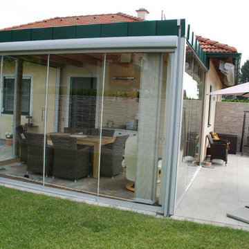 Wintergarten Anbau mit Glasschiebetüren von Sunflex