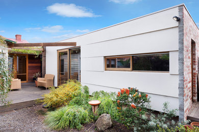 Inspiration for a contemporary exterior in Melbourne with wood siding.