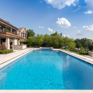 Burr Ridge Lap Pool with Raised Hot Tub and Waterfall