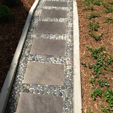 Creative use of mexican beach peddles, concrete and flagstone