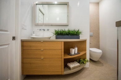 Small trendy 3/4 white tile and ceramic tile ceramic tile bathroom photo in Orange County with flat-panel cabinets, light wood cabinets, a wall-mount toilet, white walls, a vessel sink and quartz countertops