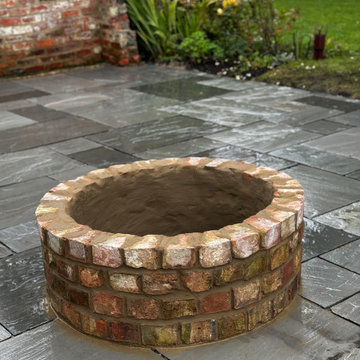 Reclaimed Brick Fire Pit With a Sett Rim Course