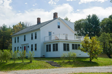 Large country white three-story wood gable roof photo in Boston