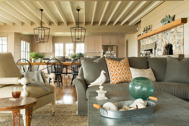 Living room - coastal open concept medium tone wood floor living room idea in Boston with a standard fireplace and a stone fireplace