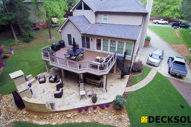 Large elegant backyard deck photo in Atlanta with a fire pit and an awning