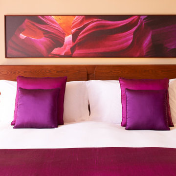 Elegant Suite Bedroom with Violet AccentsLuxury hotel bedroom – Sofitel Resort &