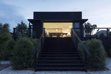 Design ideas for a contemporary backyard deck in Sydney.