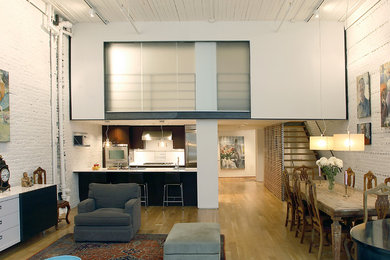 Urban formal and open concept living room photo in New York
