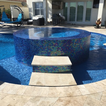 Freeform Lagoon Pool with Custom Spa LED Lights and Fire Bowls in Boynton Beach