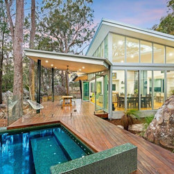 Too rock backyard with exterior view of home with breezway louvres.jpg - Windows