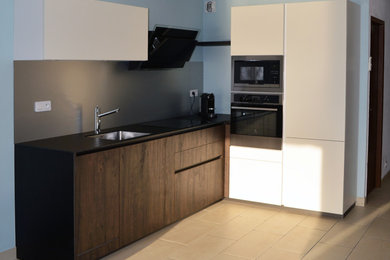This is an example of a small contemporary l-shaped kitchen in Dijon.