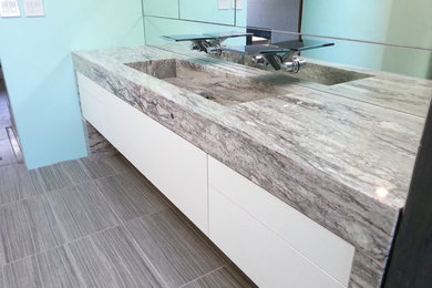 Example of a huge minimalist master bathroom design in Boston with an integrated sink, flat-panel cabinets, white cabinets and granite countertops