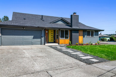 Inspiration for a large 1960s exterior home remodel in Seattle