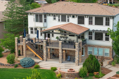 Example of an arts and crafts patio design in Denver