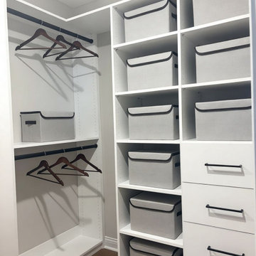 Custom Storage Wall with Adjustable Shelving and Drawers