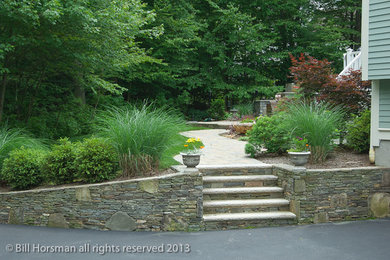 This is an example of a mid-sized traditional landscaping in Boston.