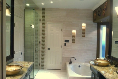 Inspiration for a contemporary master beige tile bathroom remodel in Houston