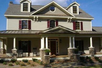 Large elegant gray three-story vinyl gable roof photo in Atlanta