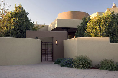 Photo of a contemporary front yard concrete paver driveway in Albuquerque.