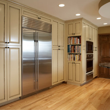 Traditional Kitchen With Ivory Cabinets and a Brown Glaze
