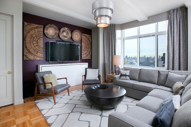 Living room - large contemporary open concept light wood floor living room idea in New York with gray walls and a wall-mounted tv