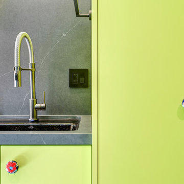 Lime Green Cabinetry and Charcoal Countertop in Colorful Laundry Room