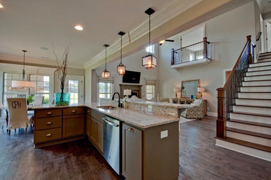 Large transitional l-shaped medium tone wood floor and brown floor open concept kitchen photo in Other with an undermount sink, shaker cabinets, white cabinets, granite countertops, multicolored backsplash, matchstick tile backsplash, stainless steel appliances, an island and multicolored countertops