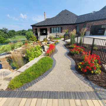 Estate Poolside Landscape & Hardscape Retreat with Custom Waterfeature