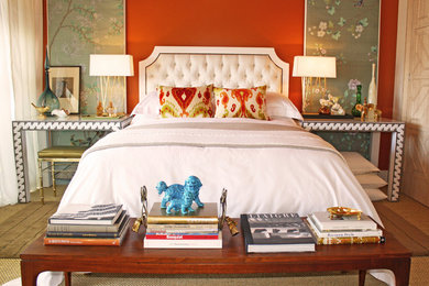 Design ideas for an eclectic guest bedroom in Orange County with red walls and carpet.