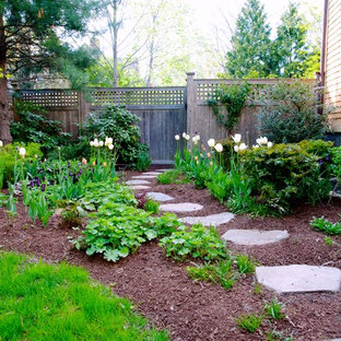 Mid-sized traditional side yard full sun garden in Boston with a garden path and natural stone pavers for spring.