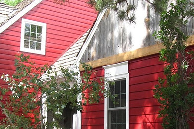 Inspiration for a red two-story exterior home remodel in Denver