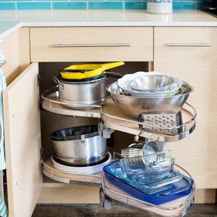 Design ideas for a mid-sized eclectic l-shaped kitchen pantry in Dallas with flat-panel cabinets, light wood cabinets, blue splashback, stainless steel appliances, concrete floors, no island, an undermount sink, quartz benchtops and subway tile splashback.