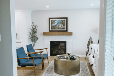 Living room - farmhouse vinyl floor living room idea in Vancouver with gray walls and a standard fireplace