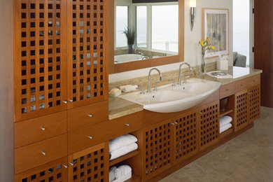 Bathroom - mid-sized contemporary 3/4 bathroom idea in Orange County with flat-panel cabinets and light wood cabinets