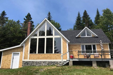 Mountain style home design photo in Other