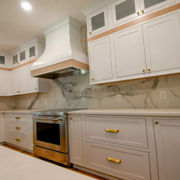 Modern and Bright Kitchen with Floor to Ceiling Storage and Rolling Ladder