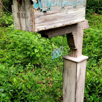 Rustic mailbox with the copper roof and custom flag