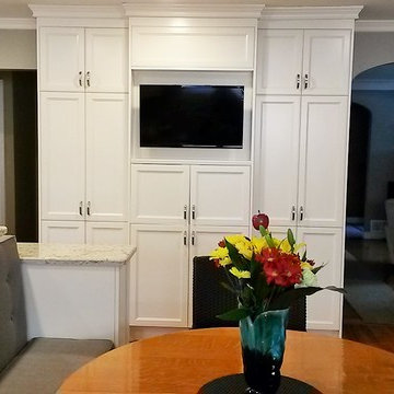 A custom white contemporary kitchen with bench seating