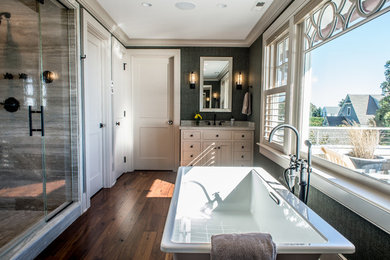 Bathroom - large stone tile medium tone wood floor and brown floor bathroom idea in Bridgeport with beaded inset cabinets, white cabinets, blue walls, an undermount sink, quartz countertops and a hinged shower door