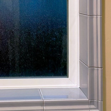 SMALL TILE DETAILS TIE THE PALETTE & FINISHES TOGETHER