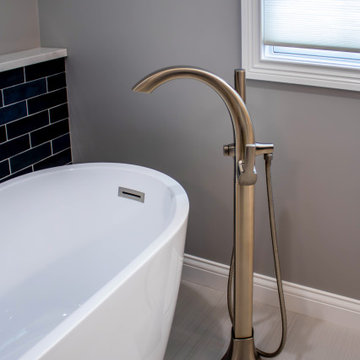 Primary Bathroom with Blue-Gray Vanity and Deep Blue Tiled Feature Wall
