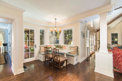 Elegant dining room photo in Denver with white walls
